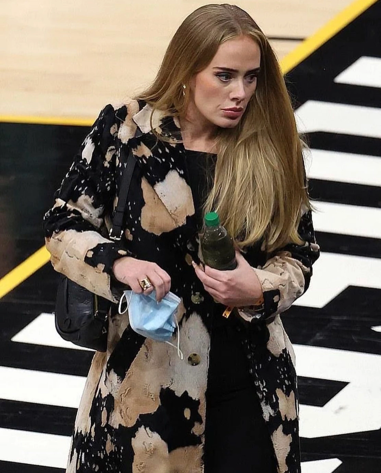 Adele with cow print coat